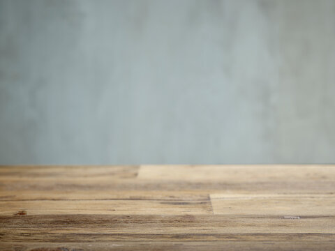 Wooden table and grey wall