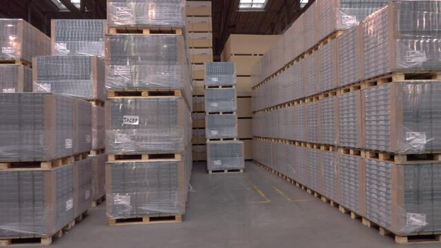 packaged for sale laminate at the factory. Plant for the production of parquet boards. Modern industrial woodworking plant. hd