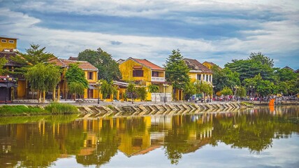 Fototapeta na wymiar Hoi An, Vietnam - August 2022 : Street life of Hoi An ancient town, UNESCO world heritage, at Quang Nam province. Vietnam. Hoi An is one of the most popular destinations in Vietnam