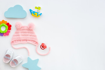 Baby girl pink hat with booties and accessories, top view