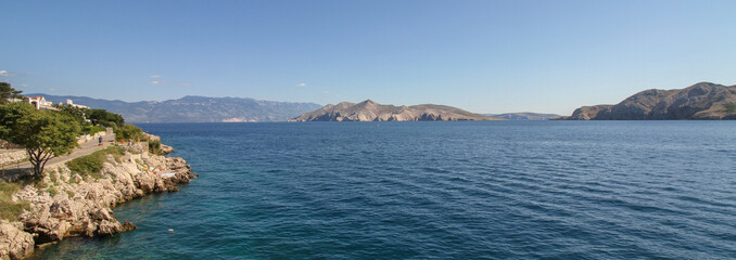 Beautiful seascape of rocky coast and clear waters of the Mediterranean Sea near Baska at the island of Krk, Croatia (Panorama)