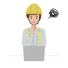 デスクで座ってPCを開いて困っている工事現場の女性