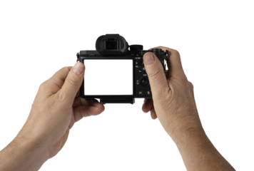 a man holds a mirrorless camera with his hands on a transparent background