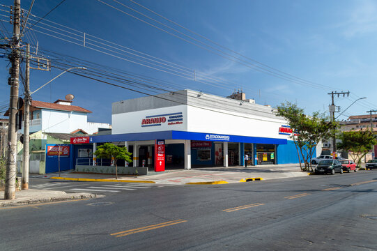 New Araujo Drogaria branch in Belo Horizonte. Drugstore Ara&uacute;jo. Dark blue sky with clouds.