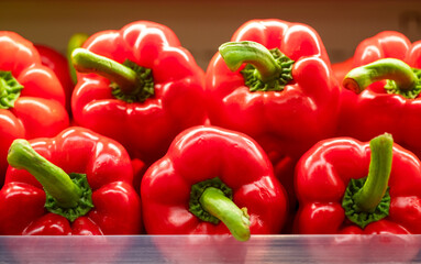Sweet red peppers on a shelf in a shopping mall