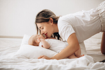 Family mother and little baby, beautiful and happy together at home, portrait