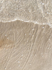 Fototapeta na wymiar Seashore landscape. Summer holiday destination in Italy. Sandy beach in sunlight.