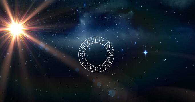 Image of wheel of zodiac signs over shining sun and stars on blue sky
