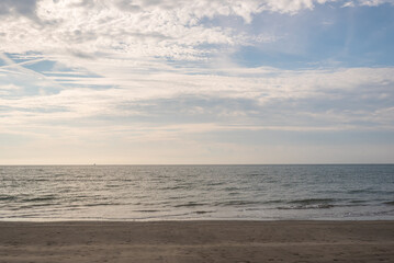 Seashore landscape. Summer holiday destination in Italy. Sandy beach in sunlight.