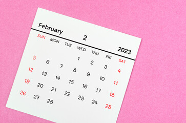 Fototapeta na wymiar The February 2023 Monthly calendar for 2023 year on pink background.