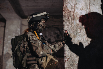 Fototapeta premium A female soldier gives a high five to her brother in arms.