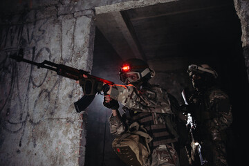 Ukrainian soldiers on the battlefield. Special forces conduct reconnaissance on enemy territory.