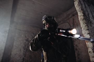 Fototapeta premium Ukrainian soldiers on the battlefield. Special forces conduct reconnaissance on enemy territory.