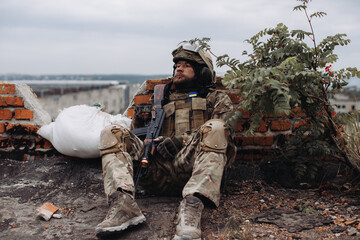 Portrait of a Ukrainian soldier in his combat position. War between Ukraine and Russia.