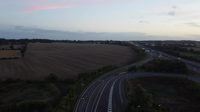 Aerial View of British Motorways With Fast Moving Traffic at Peak Time. M1 J11 and  J7 Motorways Junction Interchange. Time Lapse Shot captured on 7th Sep 2022