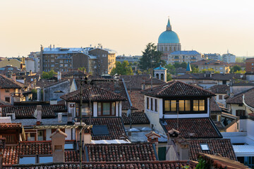 Fototapeta na wymiar view of the roofs of Udine. in the background dome of the ossuary temple