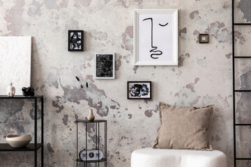 Interior design of harmonized living room with design white pouf, decorations, carpet, mock up poster frames and elegant personal accessories. Concrete grunge wall. Minimalist home decor. Template.	