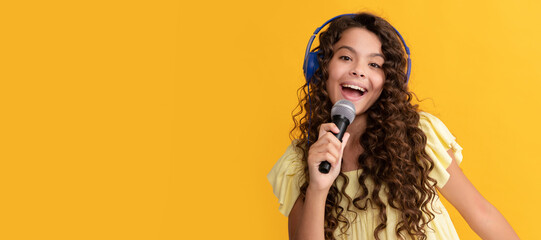 child singer sing karaoke in microphone. online vocal education. Child portrait with headphones,...