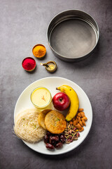 Sargi - pre-dawn meal for karwa chauth or karva chauth puja served with Chalni or strainer and diya