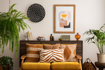 Retro and scandi style interior of living room with yellow sofa, mock up poster frame, coffee...