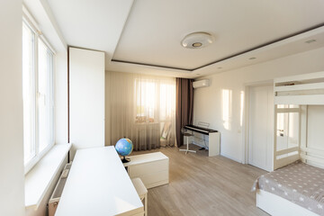 Workspace with desk and chair in modern room for children. Working table in kid's room.