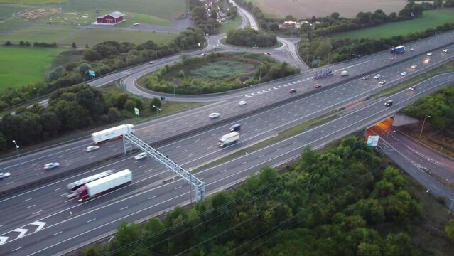 Aerial View of British Motorways With Fast Moving Traffic at Peak Time. M1 J11 and  J7 Motorways Junction Interchange. Time Lapse Shot captured on 7th Sep 2022