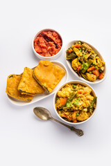 Bengali Bhog food for Indian Hindu Durga Puja or pooja festival. Khichadi, labra, tomato chutney