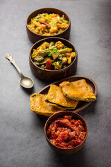 Bengali Bhog food for Indian Hindu Durga Puja or pooja festival. Khichadi, labra, tomato chutney