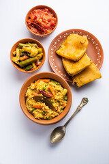 Bengali Bhog food for Indian Hindu Durga Puja or pooja festival. Khichadi, labra, tomato chutney