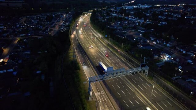 Aerial View of British Motorways With Fast Moving Traffic at Peak Time. M1 J11 and  J7 Motorways Junction Interchange. Time Lapse Shot captured on 7th Sep 2022