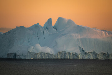 Big iceberg in icefiord in ilulissat, greenland on sunset