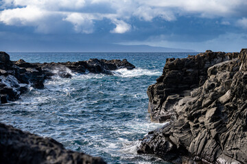 waves crashing on rocks