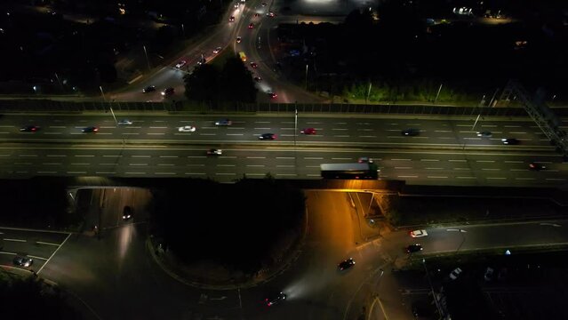 Aerial View of British Motorways With Fast Moving Traffic at Peak Time. M1 J11 and  J7 Motorways Junction Interchange. Time Lapse Shot captured on 7th Sep 2022