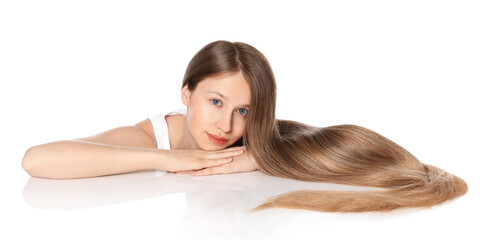 Obraz premium Teenage girl with strong healthy hair on white background