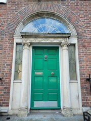 Green georgian door in Dublin, example of typical architecture of Dublin, Ireland