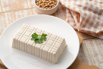 Fresh White Tofu soy bean curd on white plate