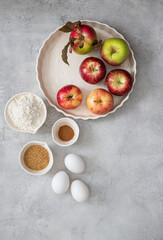 Baking concept of autumn apple pie.  View from above on kitchen table. 