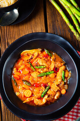 colorful turkey fricassee with asparagus and paprika