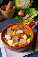 Delicious savoy cabbage stew in a rustic bowl