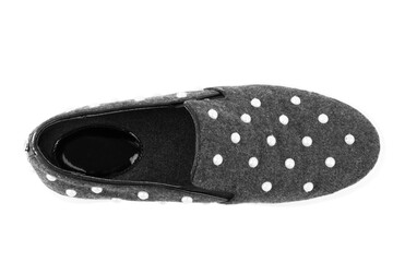 Pink sneakers on girl legs on grass