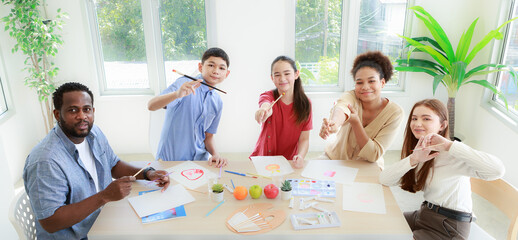 male and female students and African teachers Doing drawing and painting activities