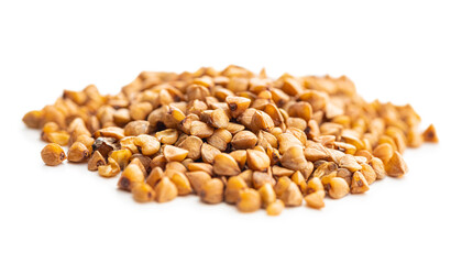 Uncooked buckwheat grain isolated on white background.