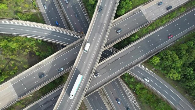 Aerial View of British Motorways With Fast Moving Traffic at Peak Time. M1 J11 and  J7 Motorways Junction Interchange. Time Lapse Shot captured on 7th Sep 2022