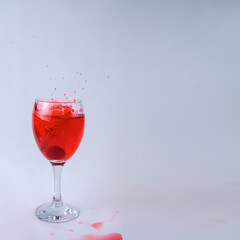raspberry fruity mix splash glass of wine red liquid fruit splashing berry drink on white background