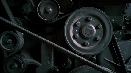 Timing belt with rollers installed on the old engine in a car workshop. photographed at close range
