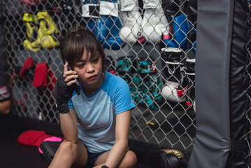A female rookie athlete calls her friends and tell them that she is nervous about the mixed martial...