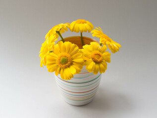 Elegant floral arrangement of yellow flowers. Beautiful bouquet on a neutral background.