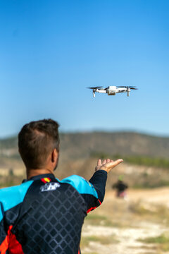 pilot flying his drone through the city
