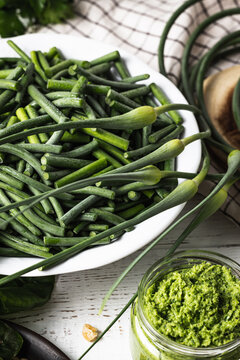Sliced ​​garlic flower stalks and basil