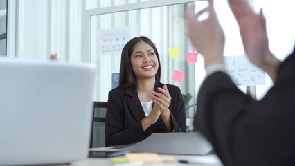 Asian senior businessman presenting an annual or fiscal year business plan meeting together.
